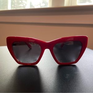 Feroce Heather cat eye sunglasses in Rouge Pigalle (red)